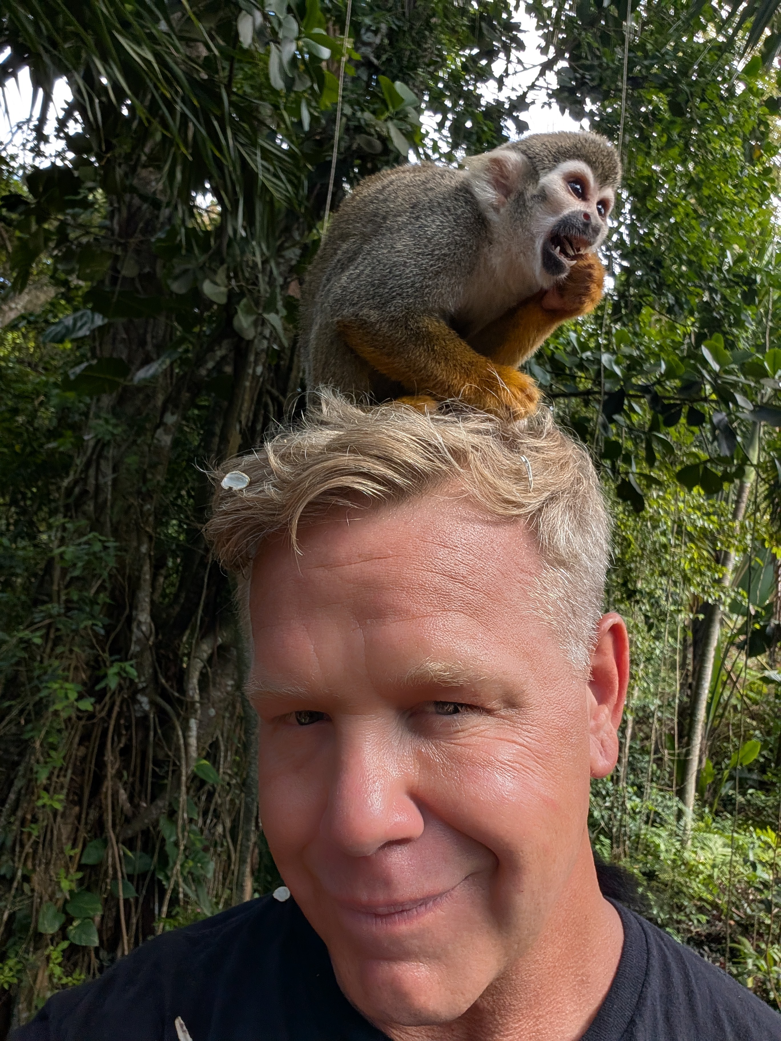 Zach Wennstedt with a monkey in the DR